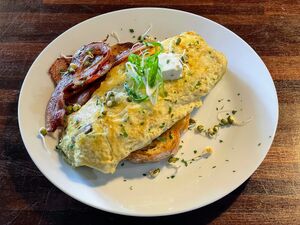 Omelette on sourdough with feta cheese and bacon.jpg